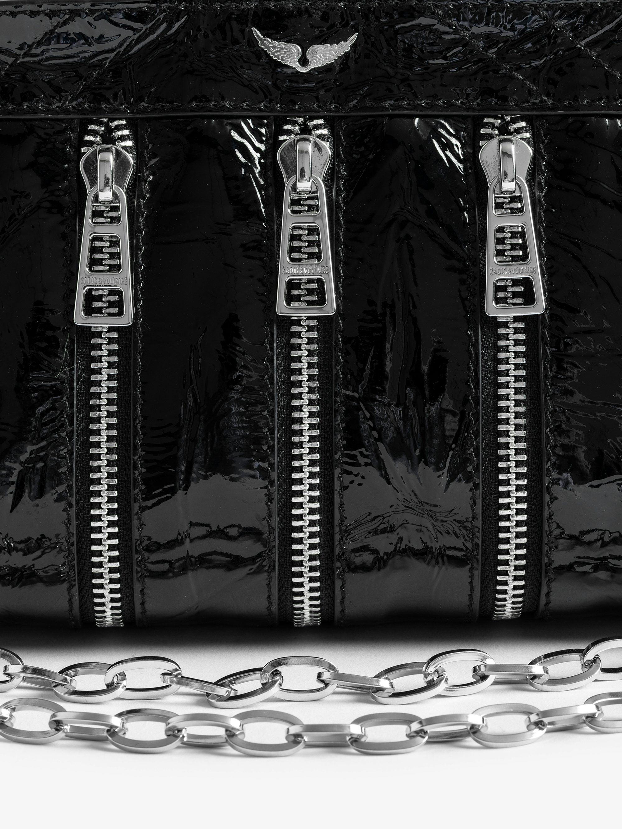 Sunny Mood Zip Bag - Small multi-zip bag in crinkled patent leather with adjustable strap and signature wings.